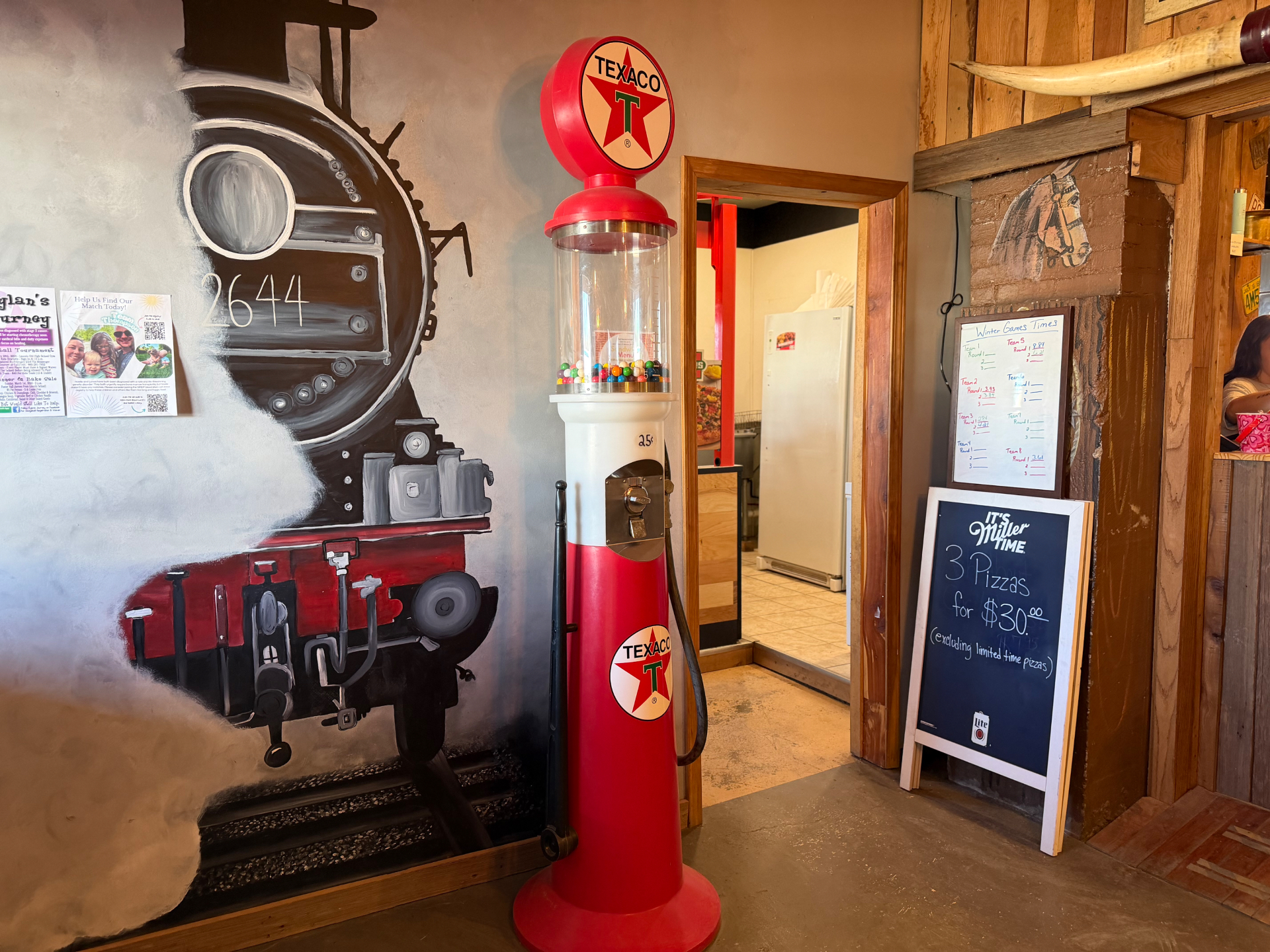 Train mural and vintage décor inside The Train Station